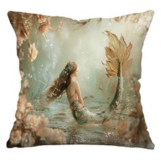 a mermaid sitting on top of a pillow in the water with her long hair blowing