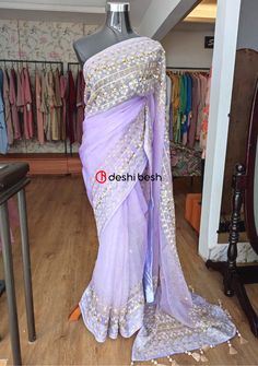 This exclusive boutique designer hand made Muslin saree is a perfect and unique choice for your occasional and party wear. All Over Thread Embroidery, Pearls, Sequences, Tassels, and Detail Hand Work. Fall & Pico Available. Matching Running Blouse Piece. Color: There might be slight color variation due to lightings and flashes while photo shooting. The color may also vary because of different screen resolutions. Wash Care: Dry Clean Only. Note: This is a hand made boutique saree and could take 1 Embroidered Purple Georgette Pre-draped Saree, Unstitched Purple Pre-draped Saree With Dori Work, Purple Pre-draped Saree With Dori Work, Purple Dola Silk Saree With Mirror Work, Purple Semi-stitched Chinon Saree, Purple Embroidered Georgette Pre-draped Saree, Designer Embroidered Purple Saree, Purple Embroidered Georgette Fabric Saree, Semi-stitched Purple Chinon Saree