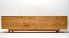 the sideboard is made from wood and has four doors on each side, with three drawers at the top