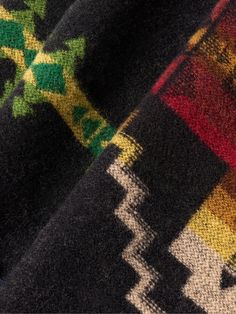 Pendleton looks to historic physical locations for design inspiration. This wool scarf is jacquard-knitted with its 'Four Corners' motif, referencing the only point in America that's shared by four states (it also marks the boundary of the Navajo Nation and Ute Mountain Ute Tribe Reservation). Black Wool Jacquard Knit Outerwear, Black Jacquard Winter Outerwear, Black Jacquard Outerwear For Winter, Scarf For Men, Navajo Nation, Scarf Men, Jacquard Knit, Fine Jewelry Designers, Four Corners