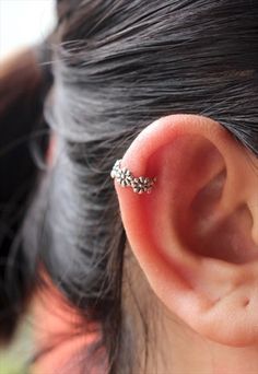 a close up of a person with an ear piercing