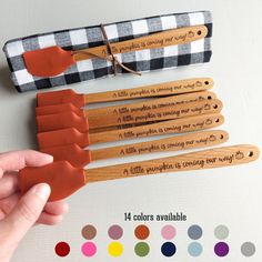 four wooden utensils in different colors and designs