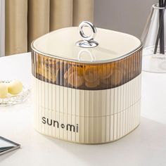 the sun & mi bread warmer is sitting on a table