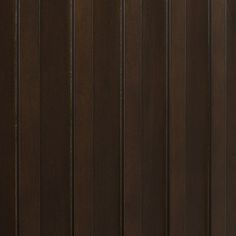 a brown wooden door with vertical slats on the sides and bottom paneling that are horizontal