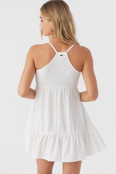 Sweet and flowy woven mini dress that features a solid color design, racerback detail and front tie closure. O'Neill Women's mini dress 25" In length Solid color wash Empire waist with bodice keyhole Tunneled spaghetti straps at keyhole Racerback 95% Polyester, 5% Elastane White Smocked Back Mini Dress For Beach, Solid Color Mini Dress With Smocked Back For Summer, White Mini Beachwear Sundress, White Beachwear Sundress Mini Length, White Mini Sundress For Beachwear, Flowy Mini Length Tops For Beach, Racerback Mini Dress For Summer, Casual Racerback Mini Dress For Spring, Breezy Sleeveless White Mini Dress