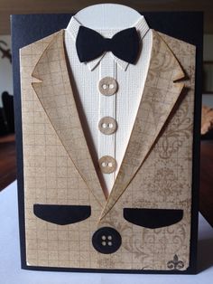 a card with a suit and bow tie on it