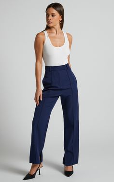 Slay the pants game with our Rogers Pants in Navy! These tailored pants are perfect for both workwear and casual occasions. The navy color adds a touch of sophistication, while the full-length style keeps you looking stylish all summer long.Pair them with your favorite high heels to elongate those legs and show off your feminine side. You'll love how comfortable these pants feel, making them the perfect addition to your wardrobe. Don't let another day go by without these must-have Rogers Pants - Ankle-length Elastane Dress Pants For Summer, Summer Ankle-length Elastane Dress Pants, Navy Straight Leg Dress Pants For Work, Navy Stretch Pants For Business Casual, Navy Straight Pants For Business Casual, Elegant Stretch Navy Pants, Elegant Navy Ankle-length Pants, Summer Straight Leg Business Casual Work Pants, Straight Leg Work Pants For Business Casual In Summer