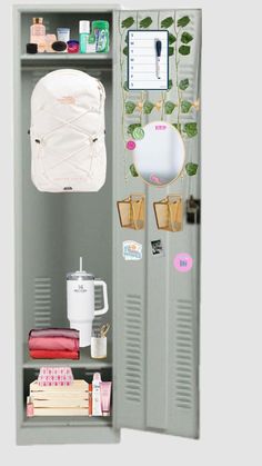 a locker with several items on it and a plant growing out of the top shelf