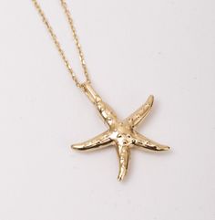 Whispers of the Waves: Allow the waves to whisper eternal tales with our Starfish Urn Pendant in 14K SOLID Gold.  This cremation charm delicately transforms into a memorial necklace--a testament to enduring love.  Dive into the serenity of the sea with this ocean-themed jewelry, a nautical urn necklace that speaks volumes, making it a heartfelt and timeless gift for her. Material: Solid Gold, real gold (not gold-filled or no gold-plated) Available Gold Karat: 14K (585) Available Gold Color: Yell 14k Yellow Gold Starfish Jewelry, Gold Nautical Jewelry With Star Charm, Yellow Gold Starfish Jewelry In Ocean-inspired Style, Ocean-inspired Gold Jewelry With Star Charm, Yellow Gold Starfish Ocean-inspired Jewelry, Ocean-inspired Starfish Yellow Gold Jewelry, Ocean-inspired Yellow Gold Jewelry, 14k Gold Starfish Charm Jewelry For Gifts, 14k Gold Jewelry With Starfish Charm For Gift