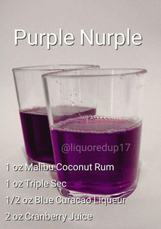 two glasses filled with purple liquid sitting next to each other