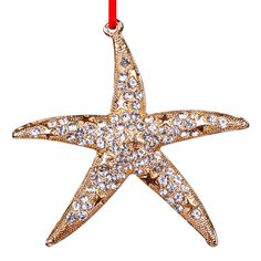 a starfish ornament hanging on a red string