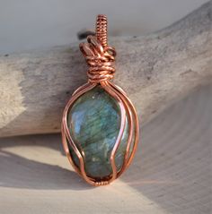 "WIRE WRAPPED,1375, LABRADORITE, Pendant, Blue, Yellow, Hand Made Setting, Copper, Model. Jb1375. JAMIE DESIGNED AND CRAFTED THIS BLUE AND YELLOW OVAL LABRADORITE WIRE WRAPPED PENDANT. The labradorite pendant is 2 1/4\" tall x 7/8\" wide. THIS PENDANT WOULD SELL IN GALLERIES STARTING AT $85.00. I GUARANTEE THIS PENDANT 100%. Thank you for considering our work. luv Bruce and Jamie" Hand Wrapped Round Pendant Jewelry As Gift, Blue Hand Wrapped Pendant Jewelry, Blue Hand Wrapped Necklaces For Gift, Hand Wrapped Blue Necklace As Gift, Hand Wrapped Blue Necklace Gift, Hand Wrapped Blue Necklace For Gift, Blue Hand Wrapped Pendant Necklace, Copper Wire Pendant Jewelry As Gift, Blue Copper Necklace As Gift