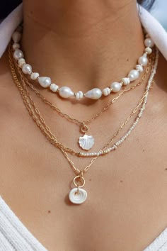 "This modern mixed pearl and chain necklace is a must have staple. The delicate freshwater pearls display a dainty statement worn alone or layered with other baubles. Wear this gold pearl necklace alone or layered for a classically elegant allure. ✦ DETAILS ✦ ✧ Name: Alohilohi (ah LO hee LO hee) - Radiant. ✧ Adjustable up to 18\". ✧ White 3mm Freshwater Pearls. ✧ 18kt Gold Filled Chain with spring clasp.. ✧ All Ke Aloha Jewelry pieces come packaged thoughtfully, beautifully, and ready for gift giving. ✦ MORE GOLD NECKLACES ➤ http://www.etsy.com/shop/kealohajewelry?section_id=11346397 ✦ Sign up here for Special Discounts and Promotions: https://kealohajewelry.com/pages/sign-up-page ✦ ✦ SHOP KEALOHAJEWELRY ➤ kealohajewelry.etsy.com ✦ POLICIES / SHIPPING INFO ➤ www.etsy.com/shop/kealohajewelr Pearl Necklace Beach Outfit, Pearl And Seashell Necklace, Pearl Beach Jewelry, Shell And Pearl Jewelry, Beach Vacation Jewelry, Seashell Gold Jewelry, Jewelry Spring 2023, Jewelry For The Beach, White And Gold Necklace