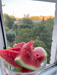 watermelon slices in a bowl on a window sill