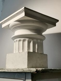 the top of a white column is shown in black and white