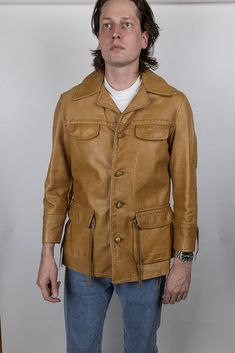 "For sale is a vintage jacket.  Has a few pulling seams at pockets and side, see photos for detail.  Tagged size 40, seems fairly true to size.  See measurements to ensure proper fit. Measurements laid flat with all buttons fastened: Pit-to-pit chest width: 22\" Waist width: 21\" Length from top of shoulder: 31.5\" Sleeve length from edge of shoulder: 24\" Model is 6'5\" 180lb, wears the following sizes: Dress shirt: 15.5\" neck, 36.5\" sleeve Suit jacket: 42L - 44L depending on cut Pants waist: Vintage Leather Jacket With Long Sleeves For Fall, Vintage Long Sleeve Leather Jacket For Fall, Vintage Outerwear For Fall, Vintage Brown Leather Jacket For Fall, Fall Vintage Fashion Single-breasted Outerwear, Fall Vintage Outerwear, Retro Single Breasted Leather Jacket With Long Sleeves, Vintage Outerwear With Flap Pockets For Winter, Vintage Single Breasted Long Sleeve Outerwear