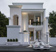 a car is parked in front of a white building with windows and balconies