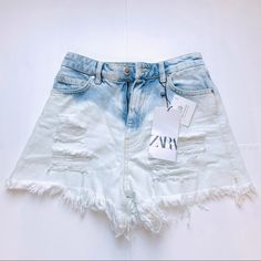 Zara High-Waist Shorts With A Five-Pocket Design. Ripped Detailing At The Front And Frayed Hems. Zip Fly And Top Button Fastening. Color: Light Blue Join Life Materials: 100% Cotton Brand New With Tag. Size 00 Fit For Xs Trendy Light Wash Bleached Bottoms, Summer Cutoff Jeans With Pockets, Trendy Bleached Denim Bottoms, Faded Jean Shorts With Pockets For Spring, Spring Ripped Faded Bottoms, Summer Faded Jeans With Frayed Hem, White Ripped Jeans For Summer, Faded Ripped Bottoms For Spring, High Rise Faded Jeans For Summer