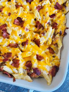 a casserole dish with bacon and cheese on it, ready to be eaten