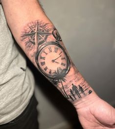 a man's arm with a clock tattoo on it