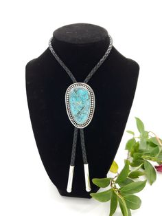 Stunning Chinese Oldstock Turquoise Bolo Tie. This piece features a gem grade Turquoise cabochon, set in sterling. Simple and timeless, this will certainly make a statement. The depth in this stone is just awesome.  All of the turquoise chosen for my bolo ties is absolutely some of the best old stock that can be found. Always priced fairly to ensure value, this is an heirloom caliber. 110 carat stone 32.5 grams sterling 5mm hand braided leather cord with sterling tips Elegant Turquoise Chrysocolla Necklace, Artisan Turquoise Jewelry For Formal Occasions, Classic Adjustable Jewelry With Large Stone, Blue Turquoise Concho Necklace As A Gift, Handmade Western Blue Jewelry, Handmade Blue Western Jewelry, Elegant Adjustable Turquoise Gemstone Necklace, Turquoise Concho Jewelry For Gifts, Western Style Turquoise Gemstone Jewelry