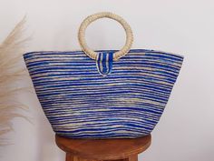 I love Mexico celebrates the native crafts of Mexico and the artists that produce them, enabling them and their communities to get recognized for their talented work and achieve economic stability for their families. This listing is for this bag shown on the picture, made of palm leaves and 100% natural materials. The tassels or other accessories on the picture are not included. Measurements : please see pictures for exact size. All size units are in inches. The bag is very nicely made, strong a Fair Trade Jute Straw Bag For Beach, Summer Straw Bag For Vacation, Fair Trade, Artisan Style Bucket Tote Bag For Vacation, Artisan Bucket Bag For Vacation, Blue Handwoven Summer Beach Bag, Fair Trade Bucket Shoulder Bag For Beach, Fair Trade Summer Straw Bag For Vacation, Summer Blue Handwoven Shoulder Bag, Blue Handwoven Summer Shoulder Bag