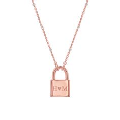 Lock in major style with this customizable Initial Padlock Sparkle Necklace. This beautiful piece is a reminder of love promised and the initials of people engraved will be forever locked and carried close to your heart. 

Size: 14.5mm(W) x 9.2mm(H)
Solid 14K Gold
Lifetime Guarantee
Made in Los Angeles Rose Gold Promise Jewelry With Initials, Rose Gold Jewelry With Initials For Promise, Engraved Yellow Gold Locket Necklace For Valentine's Day, Elegant Necklace With Lock Detail As Gift, Elegant Necklace With Lock Detail For Gift, Gold Necklaces With Lock For Anniversary, Elegant Lock Necklace For Anniversary, Luxury Lock Jewelry For Gift, Personalized Yellow Gold-plated Locket Necklace