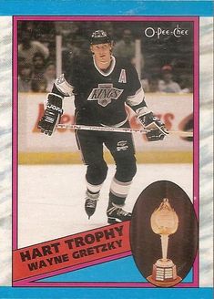 a hockey card with an image of a man on the ice, holding a trophy