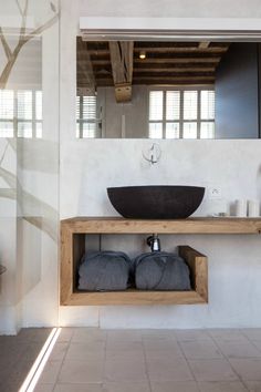 an image of a bathroom setting with sink and towel rack in the foreground, on instagram