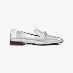 The classic loafer, distinguished by metal horsehead hardware and crafted in crinkled metallic leather. Wear it with everything from feminine dresses to menswear-inspired pieces.Crafted in partnership with a Leather Working Group-certified tannery, supporting high standards in leather manufacturing and chemical management. Classic Silver Loafers For Galas, Elegant Silver Loafers For Evening, Silver Classic Loafers For Spring, Classic Silver Loafers For Formal Wear, Luxury Silver Loafers For Galas, Elegant Silver Loafers For Galas, Luxury Silver Loafers For Formal Occasions, Classic Silver Loafers For Formal Occasions, Silver Luxury Loafers For Galas