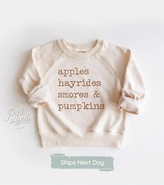 ✿ Welcome to Pint Sized Premium! ✿ Our goal is to bring you the cutest and trendiest designs on the highest quality onesies and shirts. All of our products are designed, printed, pressed, and shipped next business day from our Upstate New York boutique. Things to know: - Each item is handmade to order! - We carry several different brands, including Gerber Premium, Rabbit Skins, and Bella Canvas. Please see our size chart below :) - Machine wash cold, tumble dry low. To preserve the print for longer, wash inside out. - For personalized designs - enter customization in the "Add your personalization" field. - Orders ship next business day. - On a deadline? Upgrade to Priority Mail Express at checkout. ✰Onesies® Brand SIZE CHART ✰ 0-3 Months :: 21-24 in. / 8-12 Ibs. 3-6 Months :: 24-26 in. / 1 Cute Winter Tops For Everyday Wear, Playful Relaxed Fit Tops For Fall, Cute Cozy Fit Tops For Fall, Playful Letter Print Tops For Fall, Playful Tops With Letter Print For Fall, Short Sleeve Sweatshirt With Text Print For Fall, Fall Short Sleeve Sweatshirt With Text Print, White Tops With Funny Text For Fall, Fall Text Print Short Sleeve Sweatshirt