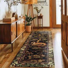 a large rug is on the floor in front of a wooden cabinet and table with potted plants