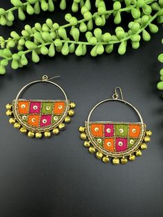 This is a beautiful Quirky beaded Earrings in multicolor gold Hoop with gold ghungroo, very light to wear and looks good on any attire. This is very beautiful to look at and a perfect one for regular wear and also parties.  Color : Gold, Multicolor length : 2.75 inch width : 2.5 inch Each earring Weight : 10.3 grams Material : Beads, Fabric Beautiful High Quality, premium jewelry. Free US standard shipping. Hand crafted in India with the finest design, this earring is of premium quality and uniq Indian Handmade Jewelry, Bohemian Gold Tassel Earrings For Wedding, Gold Bohemian Tassel Earrings For Wedding, Multicolor Chandbali Earrings For Festival, Traditional Beaded Dangle Earrings With Tassels, Traditional Beaded Tassel Dangle Earrings, Handmade Dangle Tassel Earrings For Wedding, Traditional Chandelier Earrings With Tassels And Round Beads, Handmade Tassel Earrings For Wedding