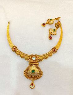 22k Real Gold Necklace Set with Gold Earrings-Antique Gold Necklace- Indian Gold Necklace- wedding Gift-Solid Gold Necklace- Gold jewellery  This is beautifully handmade Antique 22k Solid Gold Necklace along with the real gold Earrings designed in Antique theme with the touch of gemstones that gives it aesthetic look and enhances your beauty! PRODUCT SPECIFICATIONS: Material: 22k Solid Gold Weight: 42 grams approx  Design: Antique  Customer satisfaction is our utmost priority, feel free to have any query, would love to assist you! We accept custom orders as well! Jai Shree Shyam 🙏🙏 Happy Shopping 🛍️ Ganga Jamuna Gold Necklace, Goan Gold Necklace, 30 Grams Gold Necklace Indian Set, Luxury Yellow Gold Necklace For Puja, Dual-tone Kundan Chandbali Necklace For Wedding, Dual-tone Chandbali Kundan Necklace For Wedding, Ornate Dual-tone Gold Jewelry, Dual-tone Chandbali Jewelry Sets For Weddings, Gold Dual-tone Kundan Necklace For Wedding