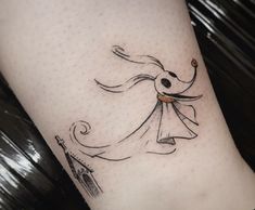 a woman's leg with a tattoo on it