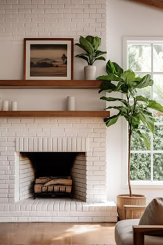 a living room with a white brick fireplace and potted plant