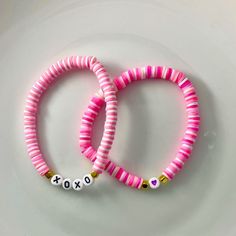 🌸 Sign up for the Starfish by Kristan email list and get 15% off your order NOW! https://mailchi.mp/13833f6189a3/new-customers 🌸 Looking for high quality, affordable jewelry?  If so, this bracelet is for you!  This adorable personalized heishi bead Valentine's bracelet is personalized just for you!   Simply pick which style you like and add your name (up to 7 characters) in the space provided.  Listing is for ONE BRACELET of your choosing. OUR BRACELETS ARE... *Made with high quality lava stones, semi-precious beads, silver, and glass beads *Tarnish free silver wire & gold wire, 925 silver, 1mm stretch cord, waxed linen cord *Crafted in house *Available in various sizes (see photo) CARE INSTRUCTIONS *Remove before swimming or showering *Do not use harsh chemicals  *Roll bracelet over han Personalized Pink Jewelry For Festivals, Personalized Pink Beaded Festival Bracelets, Personalized Pink Beaded Bracelets For Festival, Pink Heishi Beads Friendship Bracelets For Festival, Bohemian Bracelets With Colorful Beads For Valentine's Day, Pink Letter Beads Bracelets For Festival, Pink Letter Beads Bracelet For Festival, Bohemian Bracelet With Colorful Beads For Valentine's Day, Pink Jewelry With Letter Beads For Festival