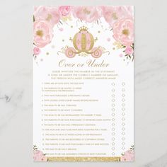 a pink and gold princess baby shower checklist with flowers on the side, in front of a marble background