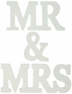 the words mr and mrs are cut out from white paper