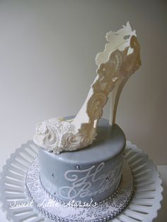 a white cake with a high heel shoe on top and the words saved from cake central