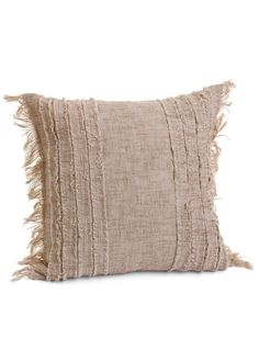 a beige pillow with fringes on the front and back, against a white background