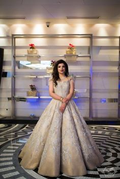 a woman in a wedding dress posing for the camera