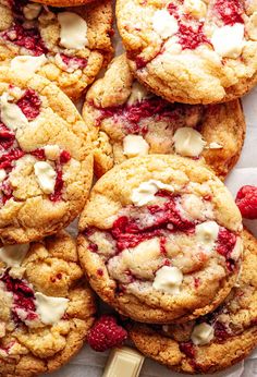 raspberry white chocolate chip cookies are piled on top of each other and ready to be eaten