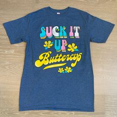 Nwt Simply Southern Short Sleeve Shirt. Suck It Up Buttercup Graphic On Front. Size Adult Small. Blue Summer Shirt With Funny Text, Summer Blue Shirt With Funny Text, Blue Shirt With Funny Text For Summer, Blue Funny Text Shirt For Summer, Fitted Blue Slogan T-shirt, Blue Fitted Slogan T-shirt, Fitted Blue T-shirt With Slogan, Blue Fitted T-shirt With Slogan, Blue Tops With Funny Text For Summer