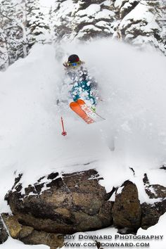 a man flying through the air while riding skis