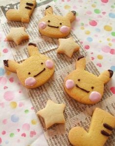 some cookies are laying on top of a table with stars and other decorations around them