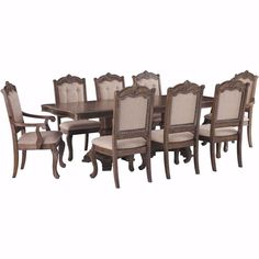 a dining room table and chairs set with beige upholstered fabric cushions on the back