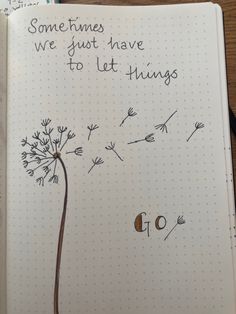 a notepad with a dandelion drawn on it and some words written in the middle