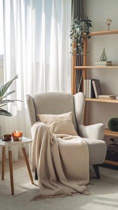 a living room with a chair, table and bookshelf