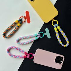 the phone case is next to two lanyards